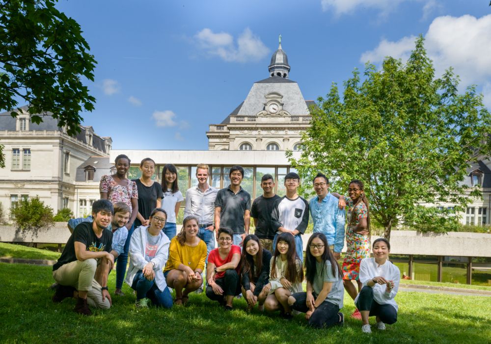 A group of smiling students poses together for a photo.