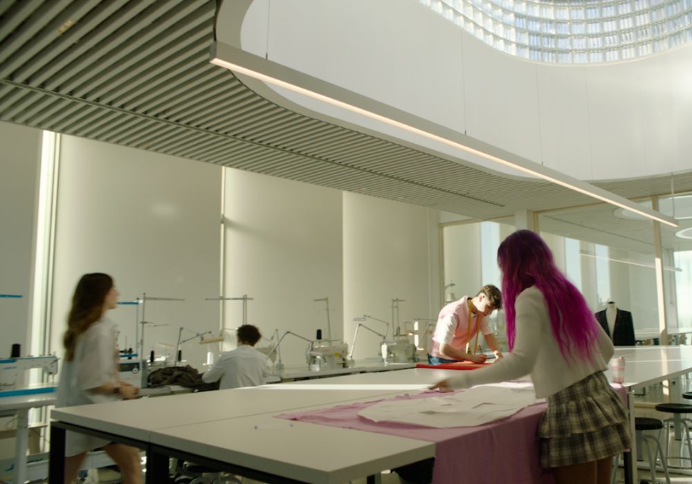 Students collaborating in a spacious workshop.